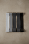 5 latex resistance bands flat lay on grey concrete