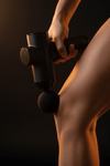 Massage gun close-up on calf